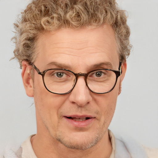 Joyful white middle-aged male with short  brown hair and brown eyes