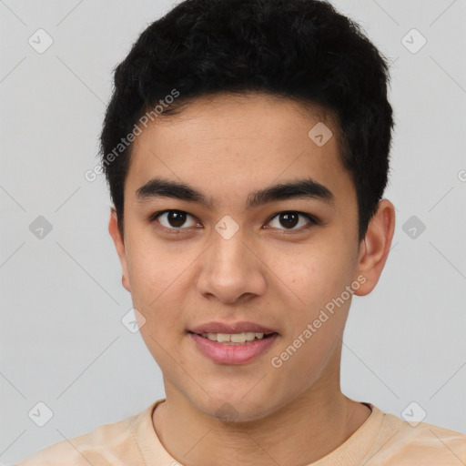 Joyful latino young-adult male with short  black hair and brown eyes