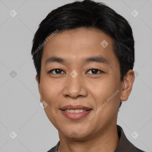 Joyful white young-adult male with short  black hair and brown eyes