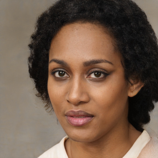 Neutral black young-adult female with medium  black hair and brown eyes