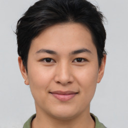 Joyful asian young-adult female with short  brown hair and brown eyes