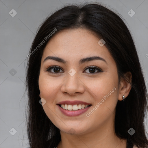 Joyful asian young-adult female with long  brown hair and brown eyes