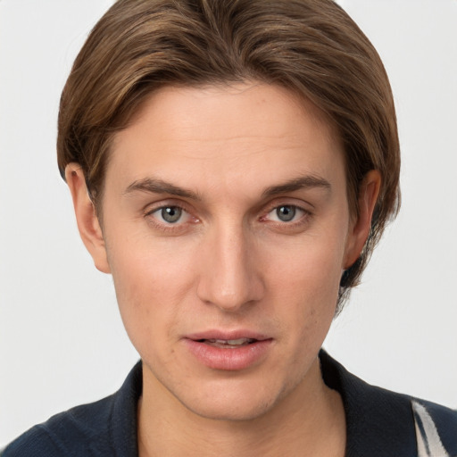 Joyful white young-adult female with short  brown hair and grey eyes