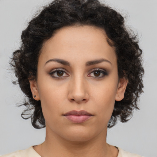 Neutral latino young-adult female with medium  brown hair and brown eyes