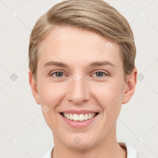 Joyful white young-adult female with short  brown hair and grey eyes