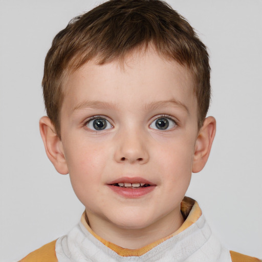 Joyful white child male with short  brown hair and brown eyes