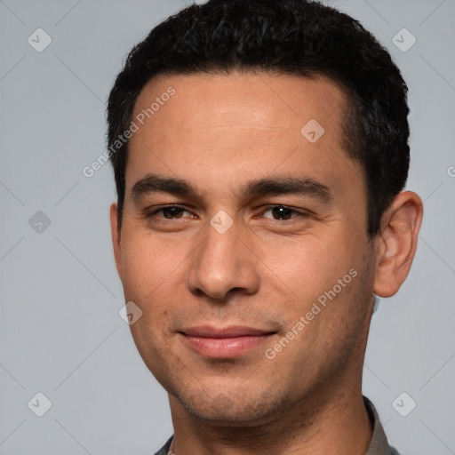 Joyful white young-adult male with short  black hair and brown eyes