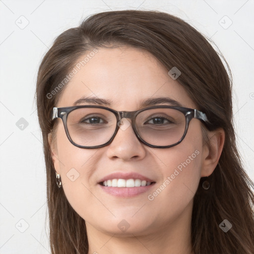 Joyful white young-adult female with long  brown hair and blue eyes