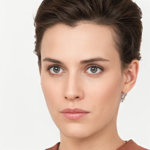 Neutral white young-adult female with short  brown hair and brown eyes