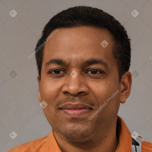 Joyful latino adult male with short  black hair and brown eyes
