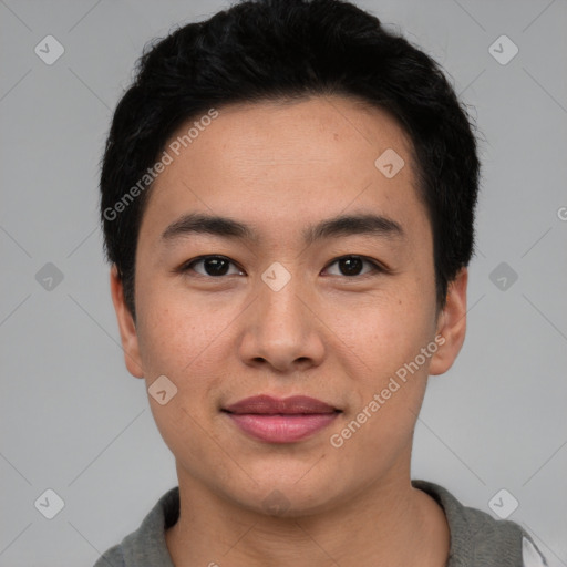 Joyful asian young-adult male with short  black hair and brown eyes