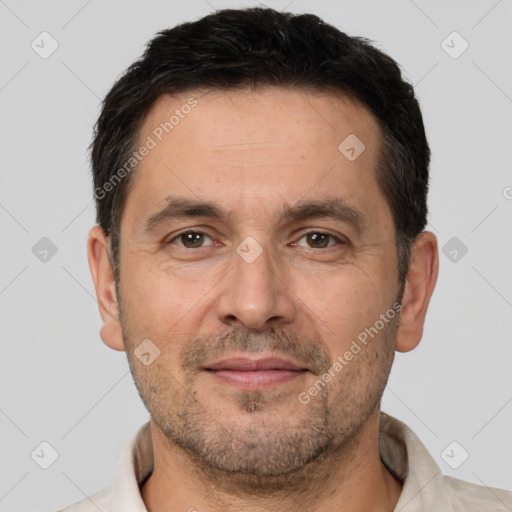 Joyful white adult male with short  brown hair and brown eyes