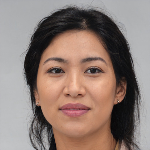 Joyful asian young-adult female with medium  brown hair and brown eyes