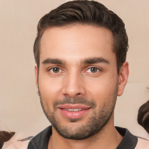 Joyful white young-adult male with short  brown hair and brown eyes