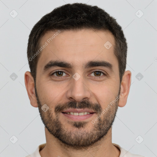 Joyful white young-adult male with short  black hair and brown eyes