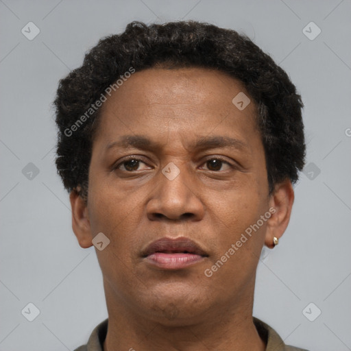 Neutral latino adult male with short  brown hair and brown eyes