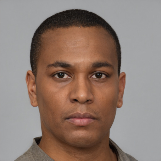 Neutral latino young-adult male with short  brown hair and brown eyes