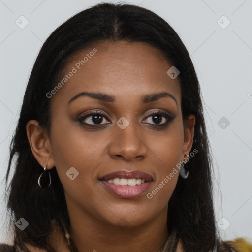 Joyful black young-adult female with long  brown hair and brown eyes