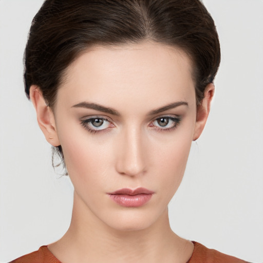 Neutral white young-adult female with medium  brown hair and brown eyes