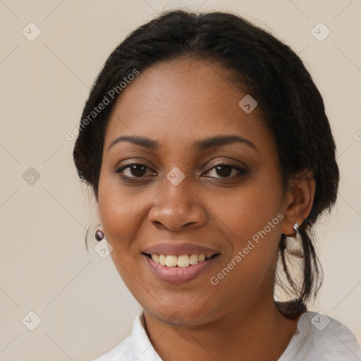 Joyful black young-adult female with medium  brown hair and brown eyes