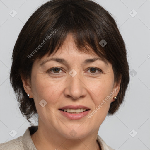 Joyful white adult female with medium  brown hair and brown eyes