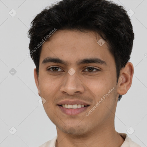 Joyful latino young-adult male with short  brown hair and brown eyes