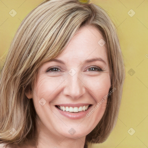 Joyful white adult female with medium  brown hair and green eyes