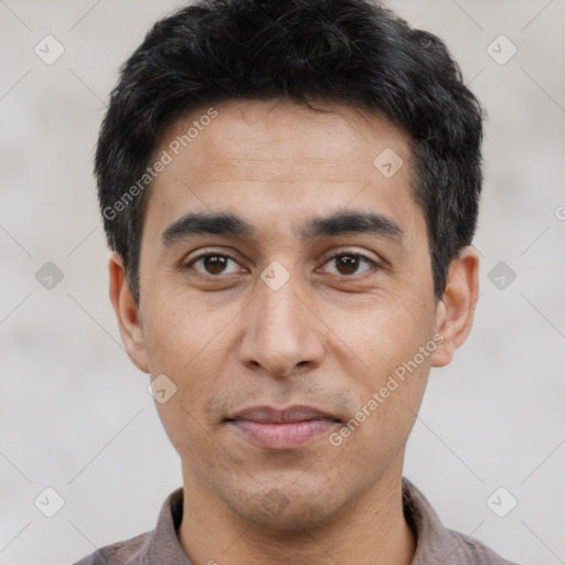 Joyful asian young-adult male with short  black hair and brown eyes