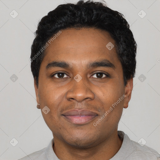 Joyful black young-adult male with short  black hair and brown eyes