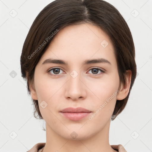 Neutral white young-adult female with short  brown hair and brown eyes