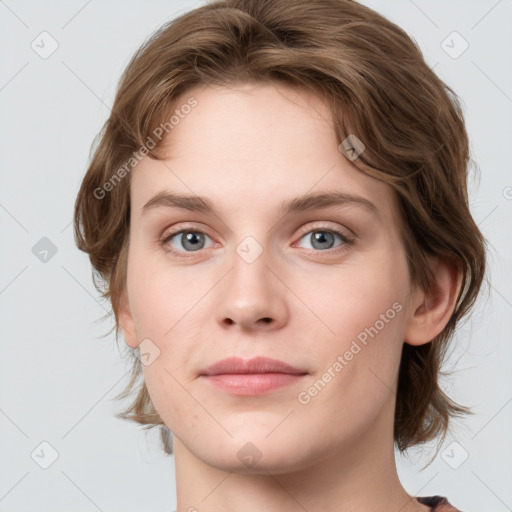 Joyful white young-adult female with medium  brown hair and green eyes