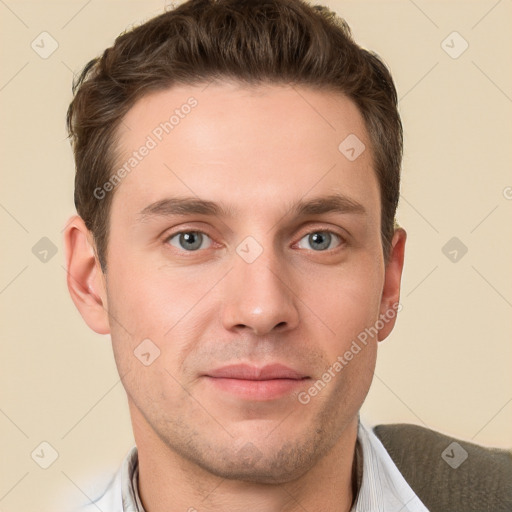 Joyful white young-adult male with short  brown hair and grey eyes