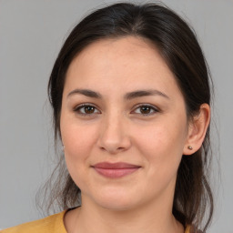 Joyful white young-adult female with medium  brown hair and brown eyes