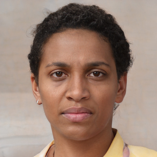 Neutral latino young-adult female with short  brown hair and brown eyes
