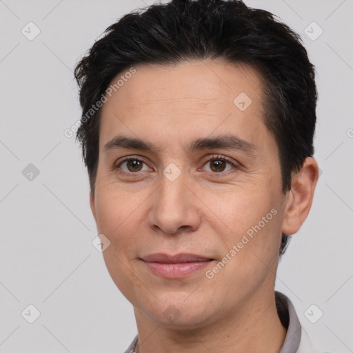 Joyful white adult male with short  brown hair and brown eyes