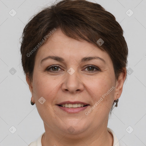 Joyful white adult female with short  brown hair and brown eyes