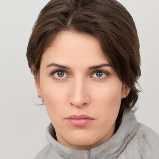 Neutral white young-adult female with short  brown hair and brown eyes