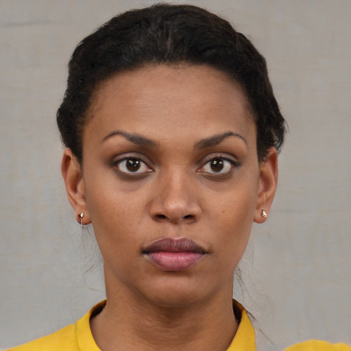 Neutral black young-adult female with short  brown hair and brown eyes