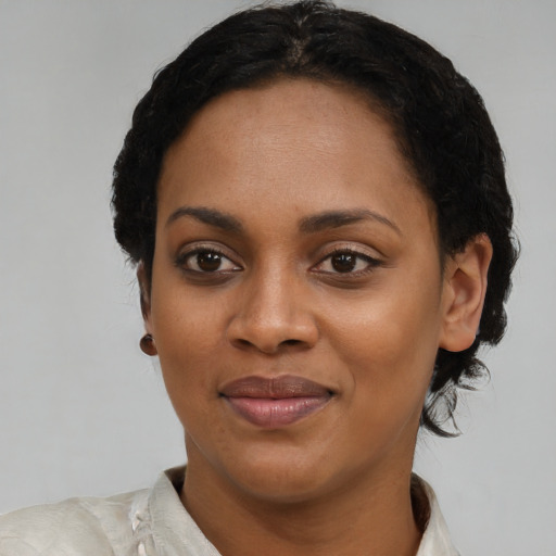 Joyful latino young-adult female with short  black hair and brown eyes
