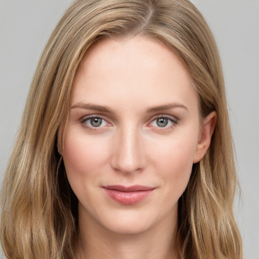 Joyful white young-adult female with long  brown hair and grey eyes