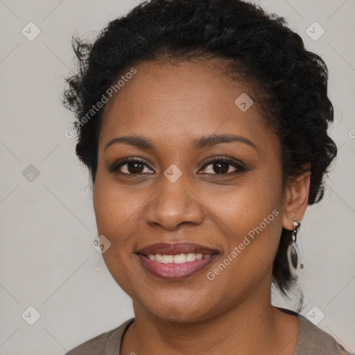 Joyful black young-adult female with long  brown hair and brown eyes