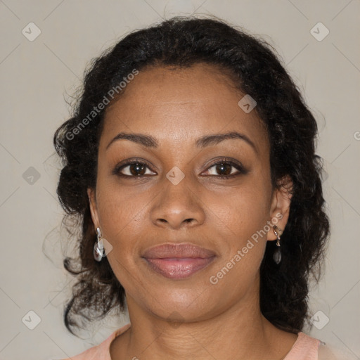 Joyful black adult female with medium  brown hair and brown eyes