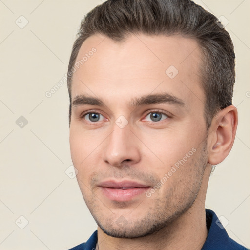 Joyful white young-adult male with short  brown hair and brown eyes