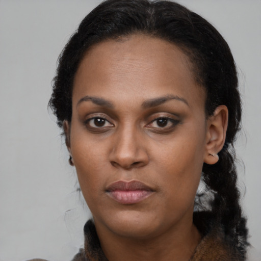 Neutral black young-adult female with long  black hair and brown eyes