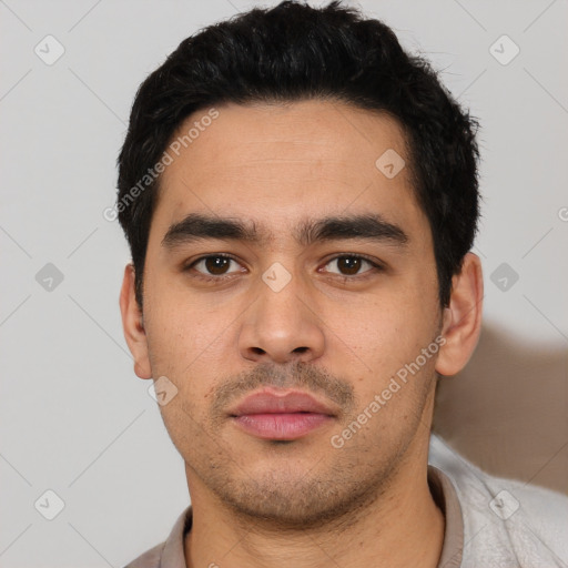 Neutral latino young-adult male with short  black hair and brown eyes