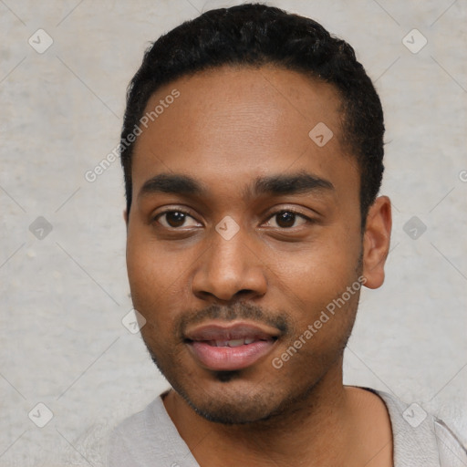 Joyful black young-adult male with short  black hair and brown eyes