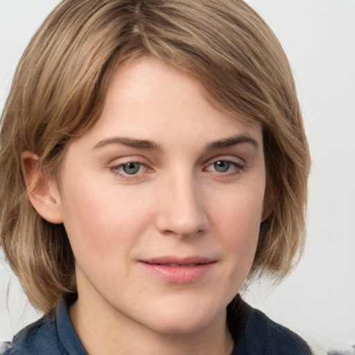 Joyful white young-adult female with medium  brown hair and blue eyes