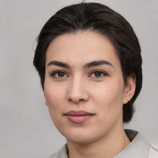 Joyful white young-adult female with medium  brown hair and brown eyes