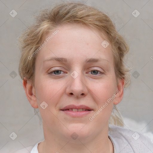 Joyful white young-adult female with medium  brown hair and blue eyes