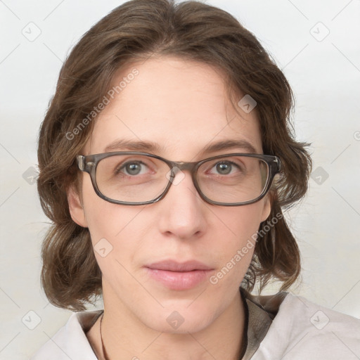 Joyful white adult female with medium  brown hair and blue eyes